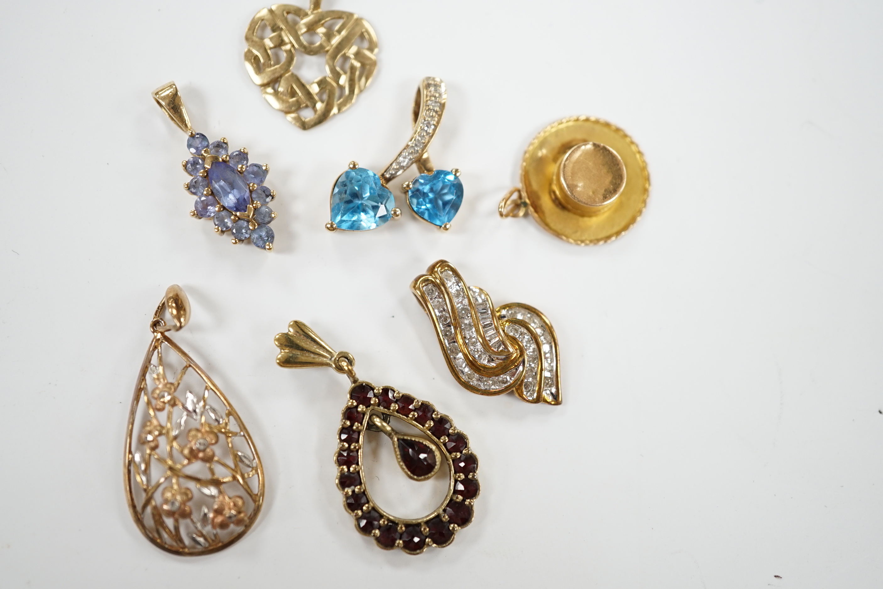 Seven assorted modern mainly 9ct and gem set small pendants, including diamond chip cluster, gross weight 10.4 grams.